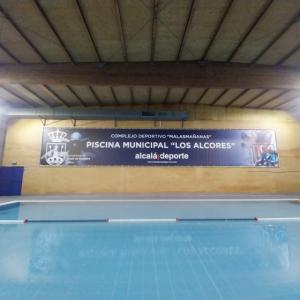 Cartel de lona publicitaria de Gran formato, enmarcado en bastidor y cosida para Malasma&ntilde;anas en Alacl&aacute; de Guadaira Sevilla.