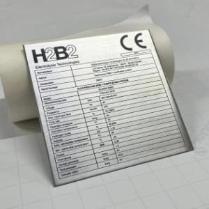 R&oacute;tulo en chapa de aluminio identificativa grabada en impresi&oacute;n. Trabajos para H2B2 en Dos Hermanas Sevilla.