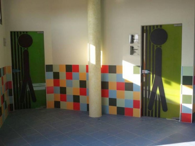 Rotulación fotomural en vinilo. Instalaciones deportivas Entrenúcleos Dos Hermanas Sevilla