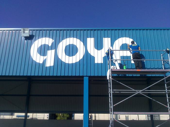 Rotulación de frente de chapa. Fábrica de aceites Goya, Ctra Sevilla Málaga