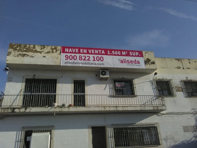 Lona publicitaria para venta de viviviendas y locales en distintas poblaciones de Sevilla para Aliseda.